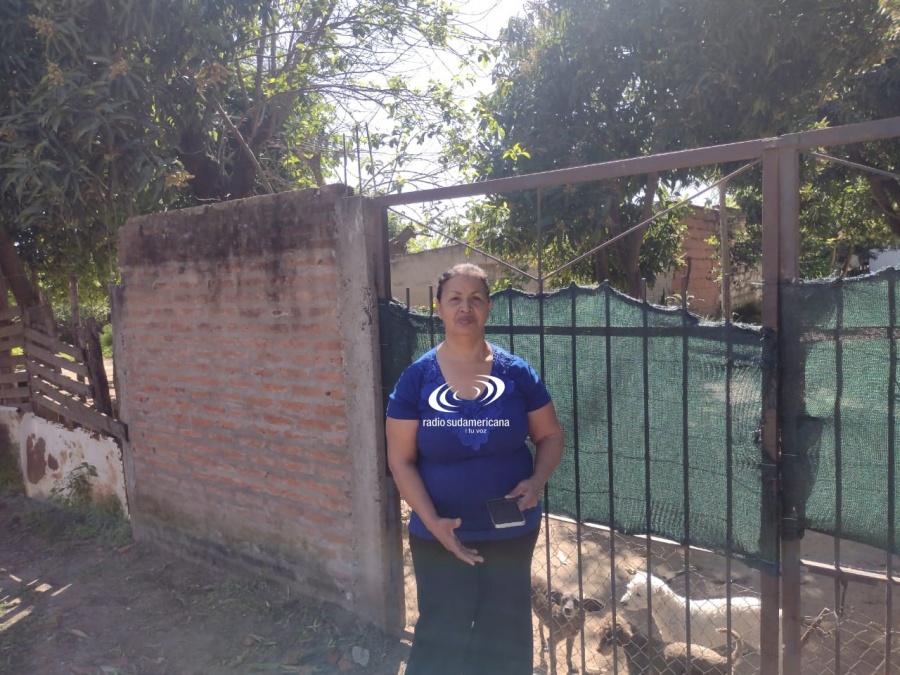 PREOCUPACIÓN DE UNA MUJER POR LAS AMENAZAS CON ARMA DE FUEGO DE SU VECINA